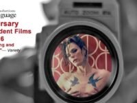 Poster for 'The Filmmaker' showing the lead character's face reflected in a camera lens.